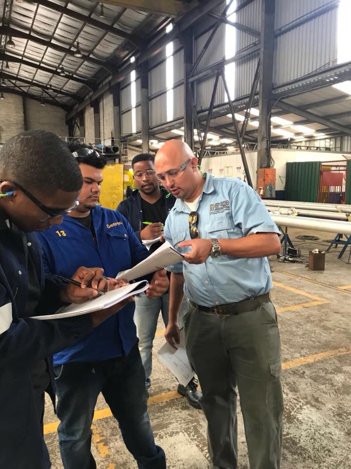 RESS consultant auditing documentation with a workshop team
