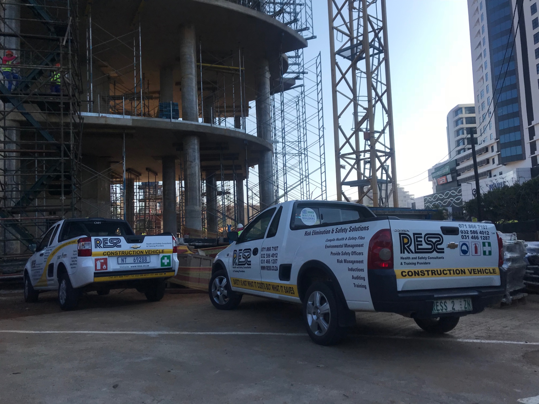 RESS International branded vehicles at a multi-storey construction site