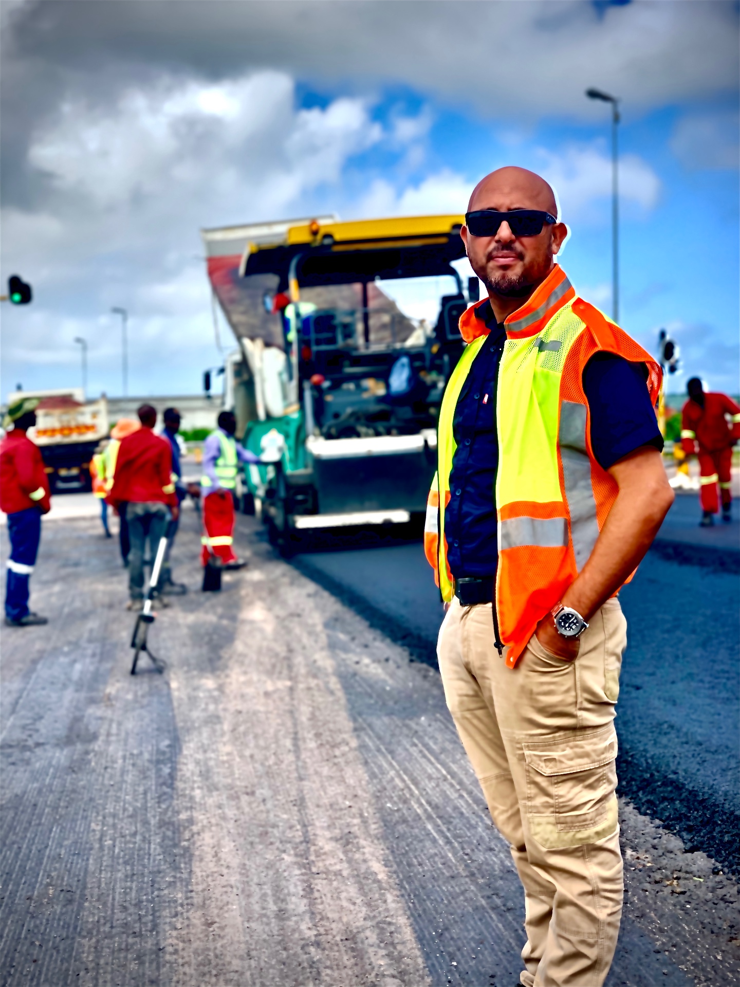 RESS safety officer on a roadworks site beside heavy equipment