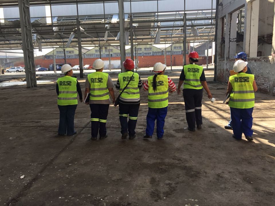 RESS safety officers walking down an industrial steel structure