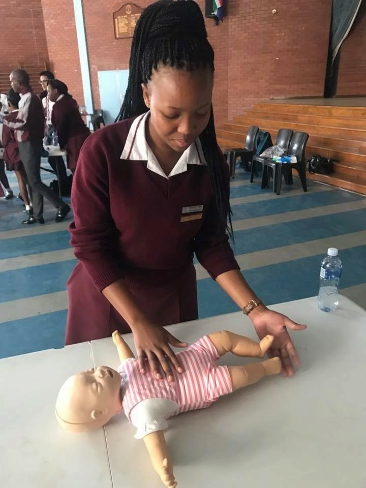 Learner practising infant CPR during a RESS first-aid course