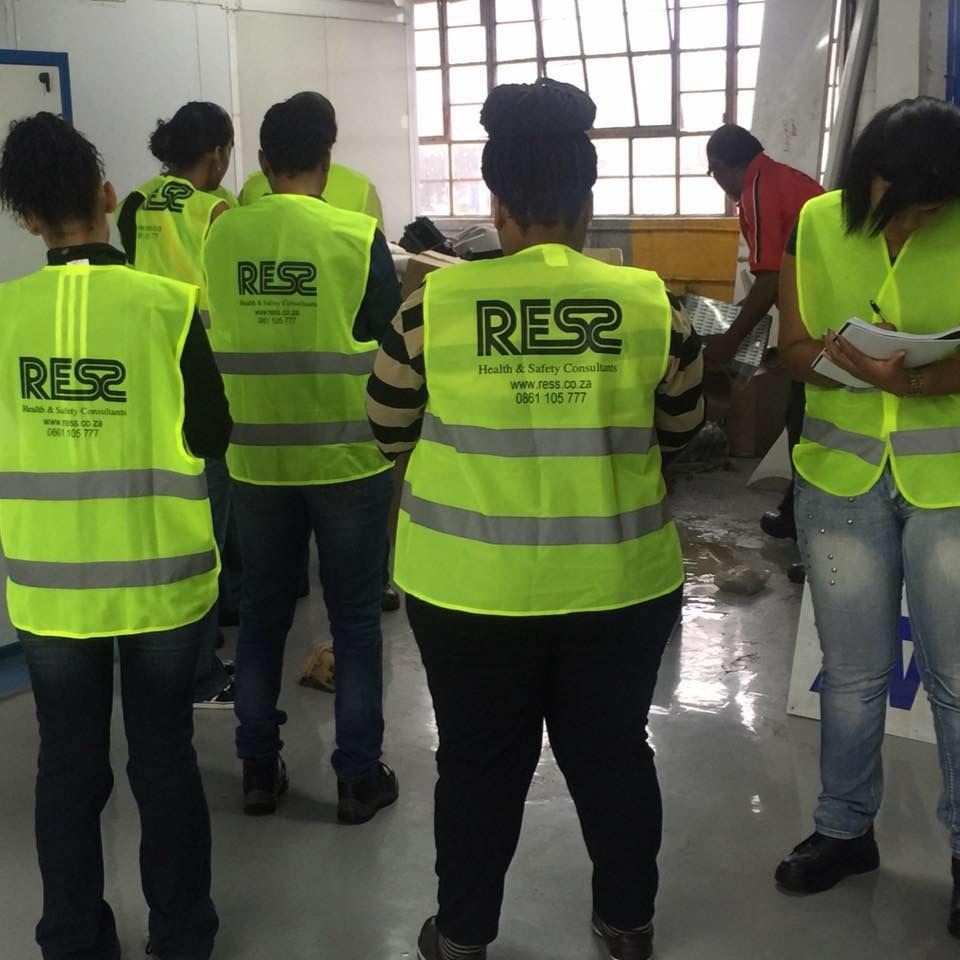 RESS safety officers inside an industrial manufacturing building