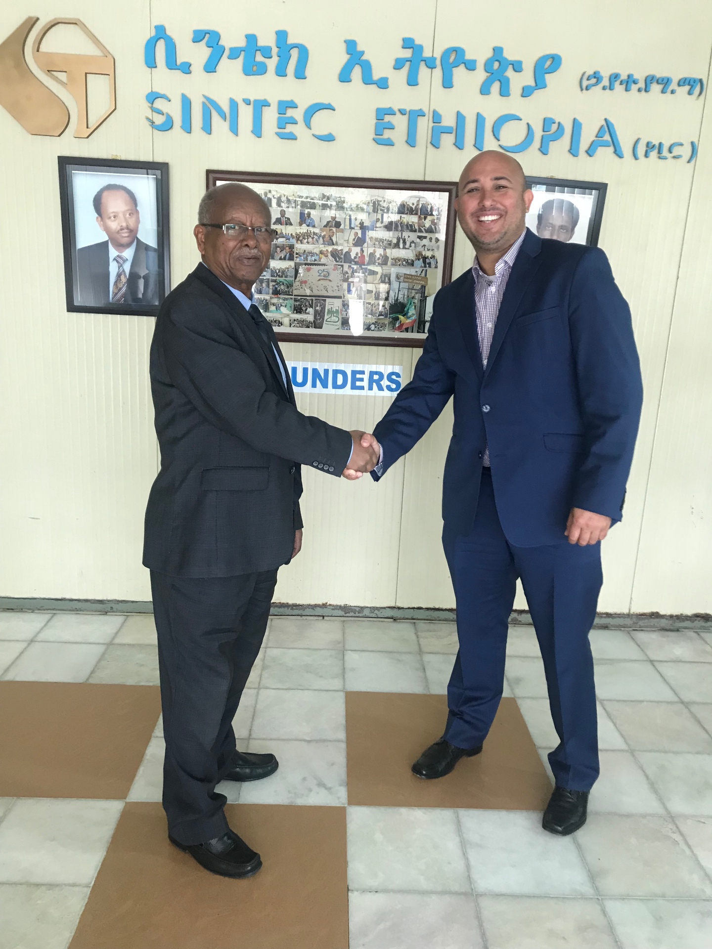 RESS International director shaking hands with a partner at Sintec Ethiopia
