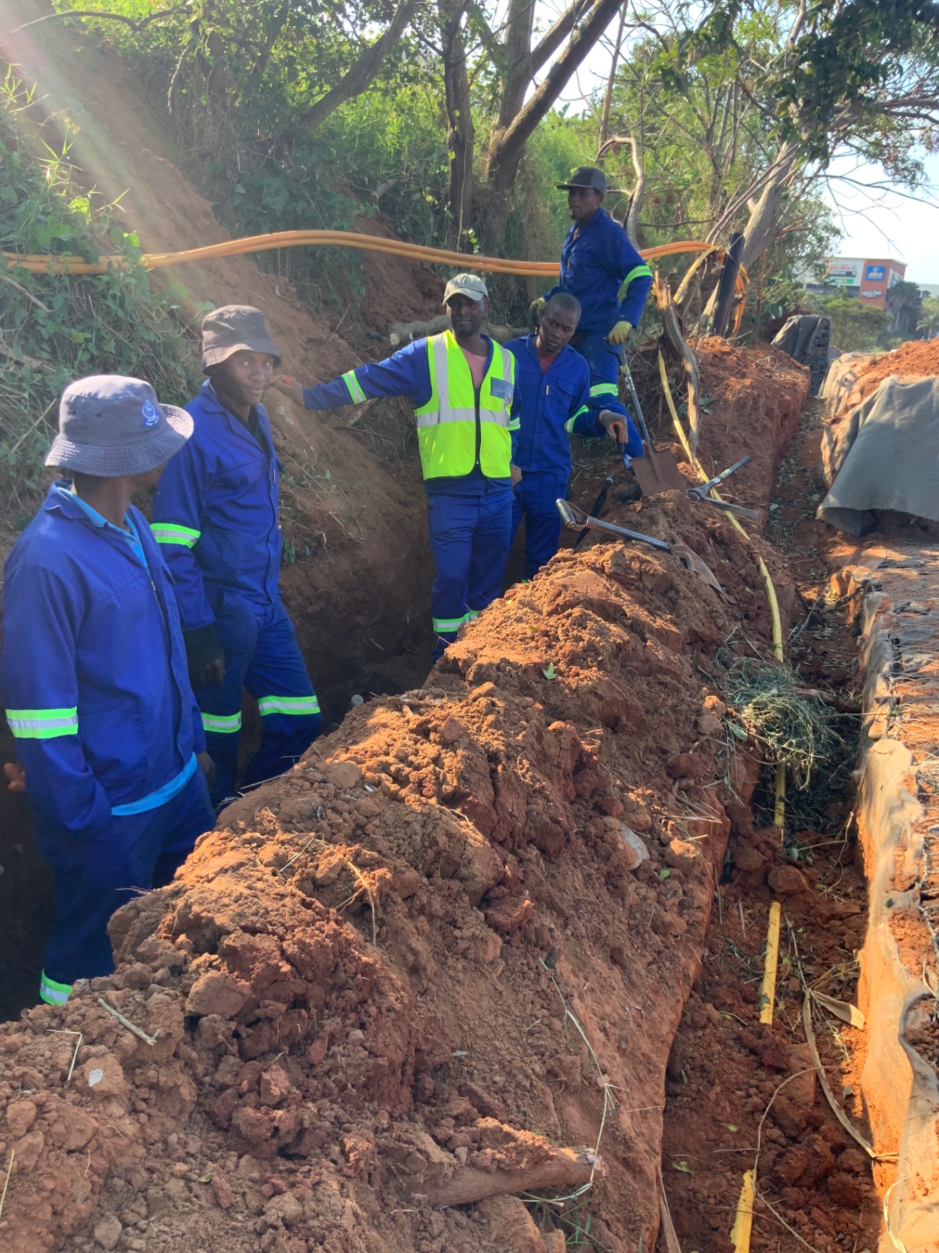 RESS team working in a trench with utility cables
